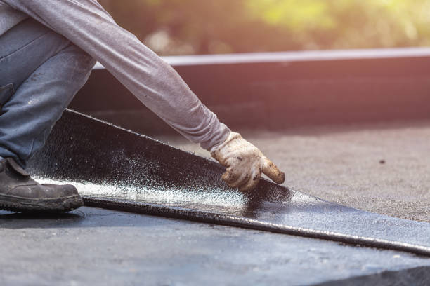 Professional Waterproofing technician working in Riley, KS